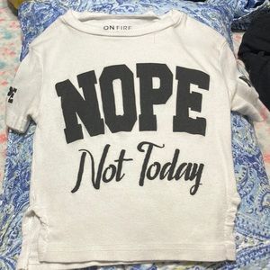 White with black letters it’s size small and it’s on fire brand